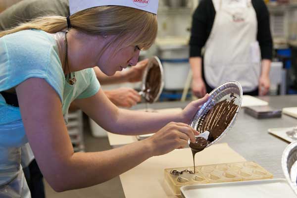 Boehm's Candies picking a chocolate mold