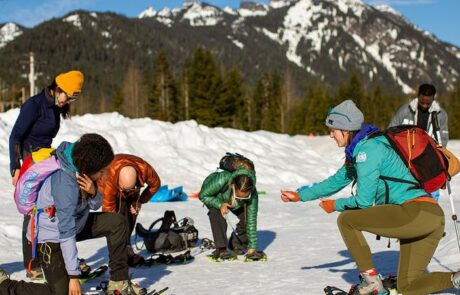 REI Snoqualmie Pass putting on snowshoes
